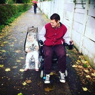 man-and-baby-in-buggy-pod-baby-carrier-sidecar