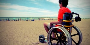 kid-in-a-wheelchair-on-the-beach