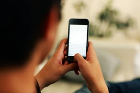 Closeup portrait of a man using smartphone