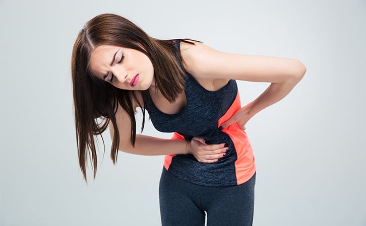 woman having muscle spasms