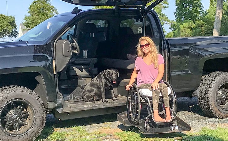 woman in a wheelchair on his modified vehicle by ATC